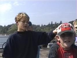 Fergus putting something unfriendly in Craig's hoodie